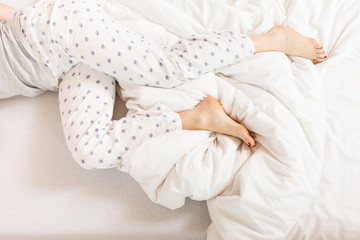 Sleepy woman sleeping in the bed.
