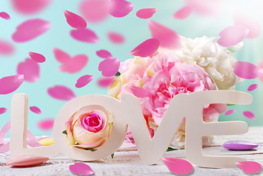pastel love background with falling rose petals