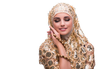 Muslim woman in gold cover isolated on white