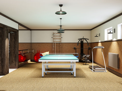 Home Gym In The Basement With Fitness Equipment And Table Tennis