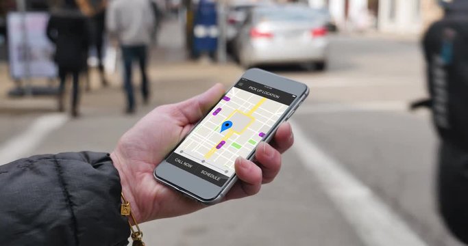 A woman uses a smartphone to observe ride sharing traffic patterns on an interactive map in a fictional city.	 	