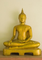 Glowing golden Buddha in watkhaoruak Phichit, Thailand .