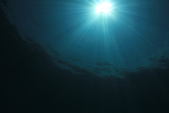 Underwater ocean background with sunlight
