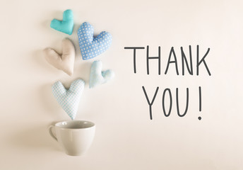 Thank You message with blue heart cushions