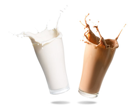 Milk and chocolate milk splashing out of glass., Isolated white background.