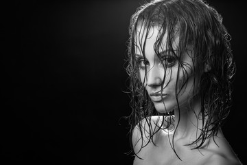 beautiful woman with wet hair looking at camera, monochrome image