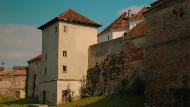 A panning shot showing exquisite detail of the Old Medieval Citadel in Brasov, Romania
