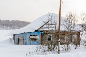 The abandoned house under snow. The house in which not who doesn't live in the winter.