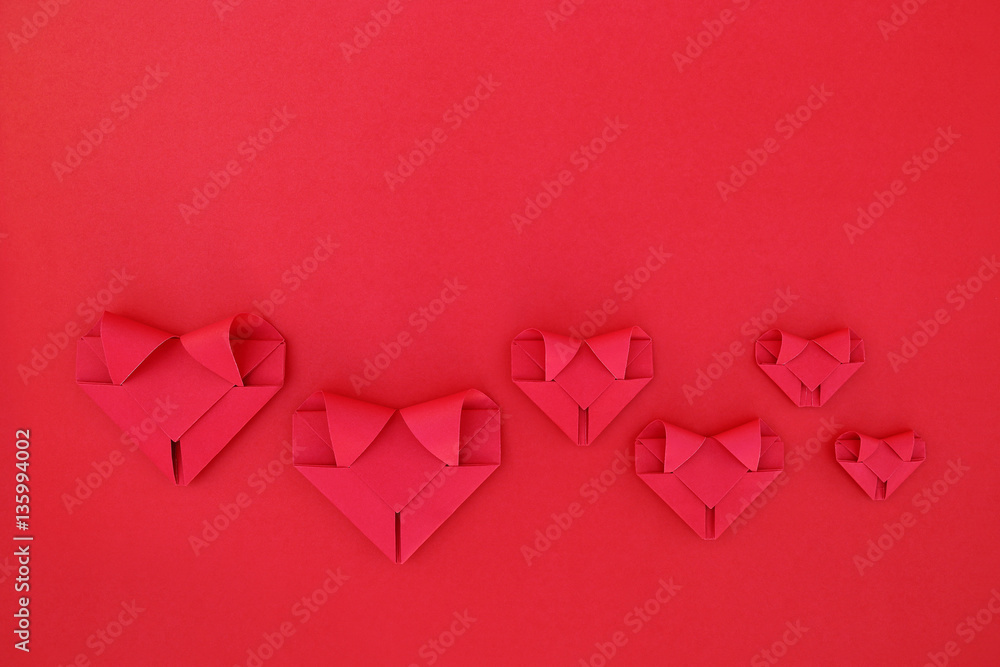 Poster six folding red paper hearts on red for valentine pattern and ba