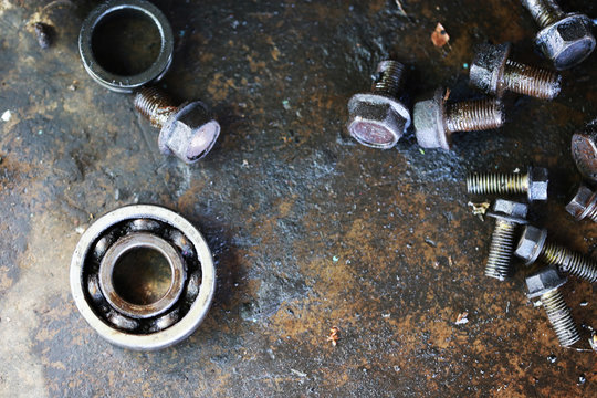 Group of screws and wrenches. Bolts, nuts, screws, wrenches, tires , ring spanners and socket wrenches in a pile on dark background.