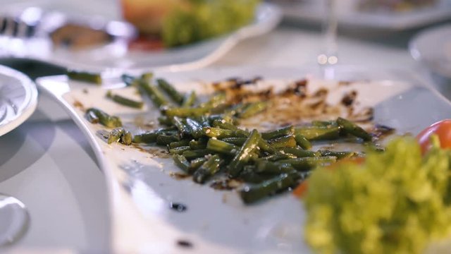 Close up of plates with orts in 4K