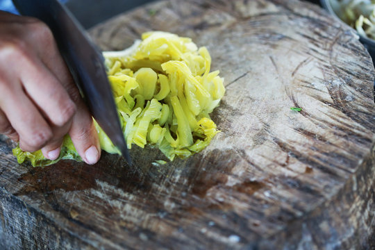 Pickled vegetables chinese food with slice on wooden