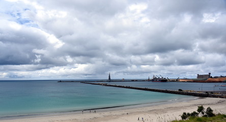 Portland beach, Lee breakwater and harbour on a cloudy day. View from Vested Land Park. Portland is the oldest European settlement in Victoria state, Australia, located in Portland Bay.