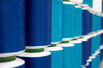 Closed up of various blue color thread reel background