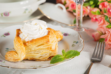 Puffs with cheese are on the table. Very tasty and delicious breakfast.
