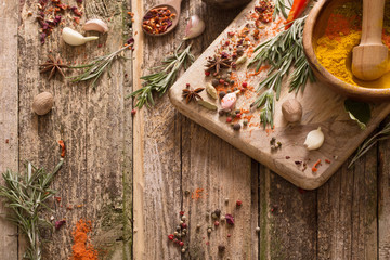 herbs and spices on a wooden background