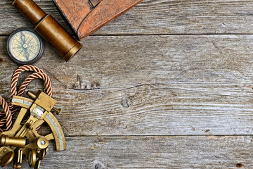 vintage still life with compass,sextant and spyglass