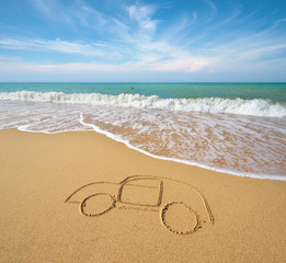 Draw car on beach sand.