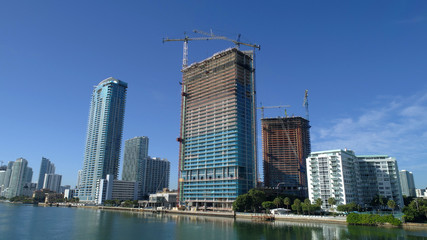 Fototapeta na wymiar Photo of construction at Edgewater Miami with clear blue skies