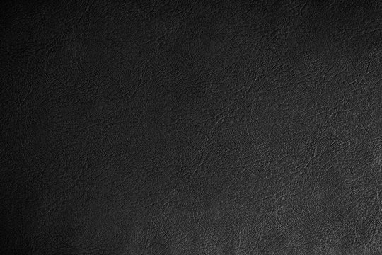 Black leather texture  background, close up.