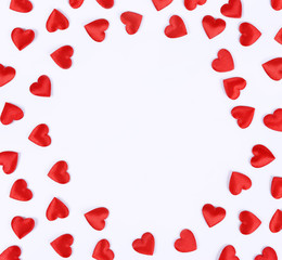 Frame from red hearts on white background.