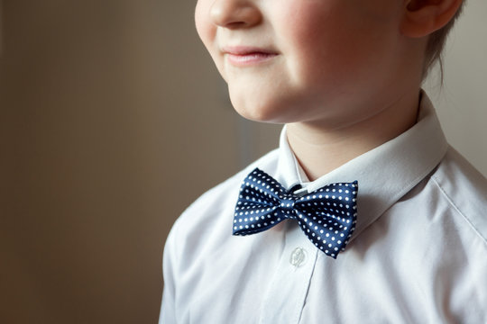 young boy with blue bow tie