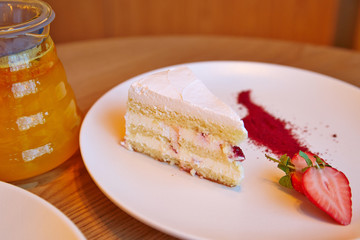 strawberry cake, glass teapot, fruit tea
