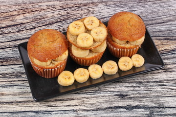 Homemade banana cakes topped sliced banana.