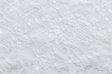 White lace with small flowers fabric texture background