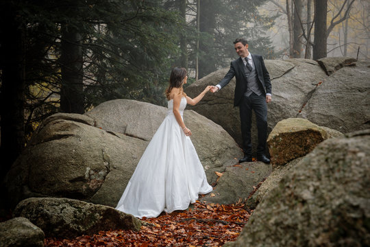 Man gives a hand to bride