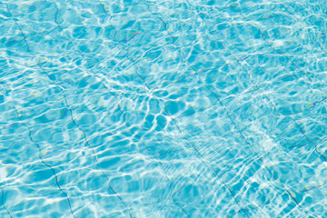 Blue ripped water in swimming pool.