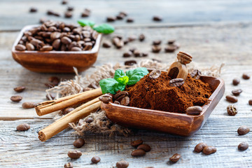 Ground coffee in a wooden bowl and sticks Ceylon Cinnamon.