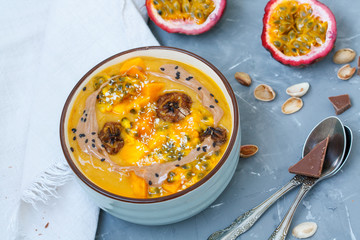 Vegan breakfast: smoothie bowl with mango and passion fruit. Love for a healthy vegan food concept
