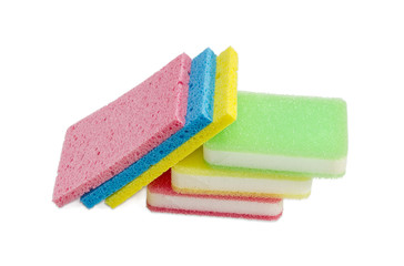 Different synthetic cleaning sponges on a light background