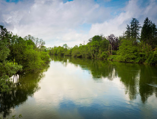 Fototapeta na wymiar lake with reflection of trees and sky