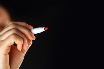 Female hand with marker pen and copy space