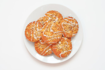 Round cookies with sunflower and sesame seeds, top view, small d