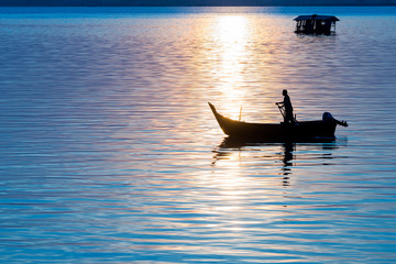 Fisherman boat catching fish