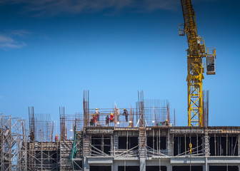 Construction workers at the top of buidling