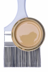 Paintbrush and Can Lid with Creme Color Paint Isolated on White Background, Top View