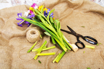 Spring flower arrangement against a rustic background