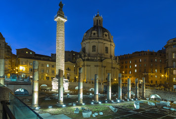 Rome, Italy. The ruins of the Forum of Trajan, 100 - 112 years AD. Trajan's Column (113) and the Church of the Holy Name of Mary (1736 - 1738). Night lights