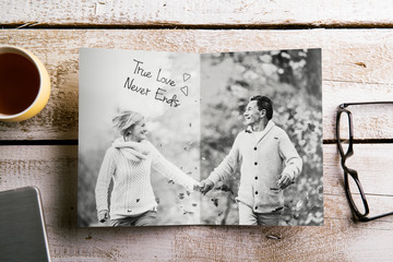 Black-and-white photo of senior couple in autumn nature, studio