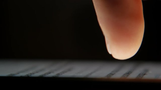 man scrolls news feed on the smartphone screen, macro