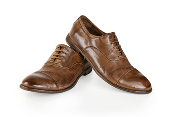 Pair of brown leather men shoes isolated on white. Men Brown Shoes. Stylish brown leather shoes. Men's classic brown leather shoes isolated on white background.
