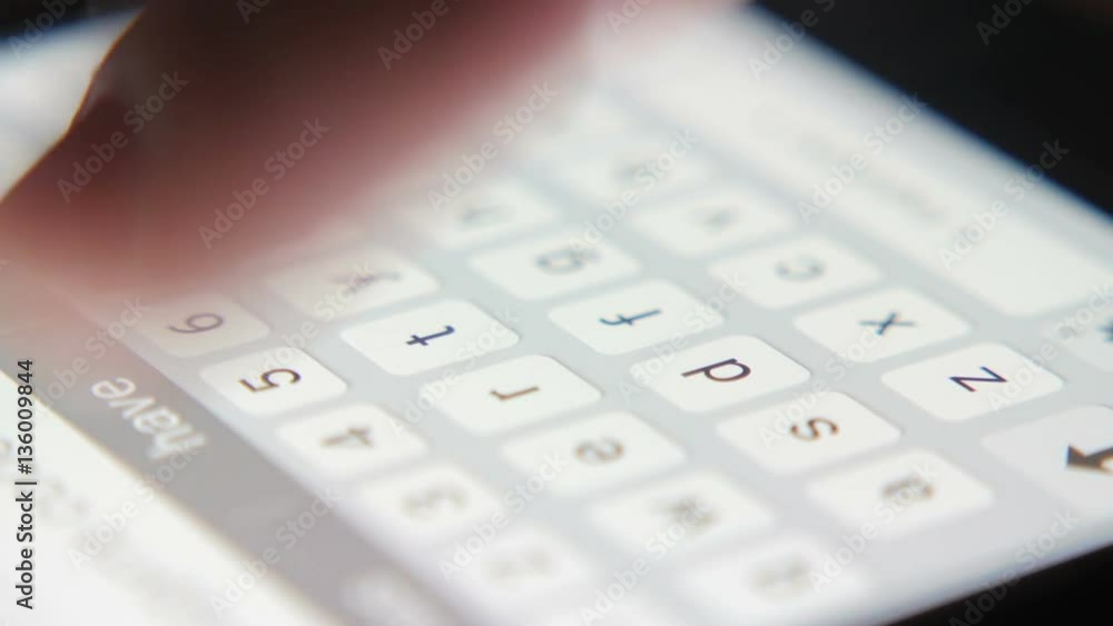Wall mural man typing on the phone keypad, macro