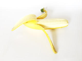 Half peeled banana, isolated on white