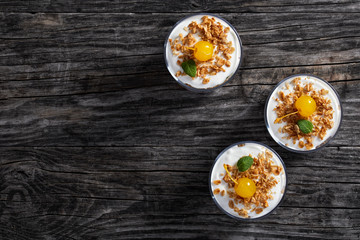portions of  granola decorated with cocktail cherry and mint