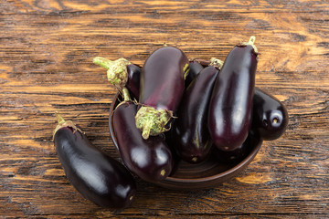 harvest of eggplant on a wooden table