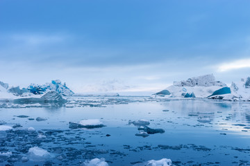 Fototapeta na wymiar Blue Icebergs in Glacier Lagoon, Jokulsarlon, Iceland